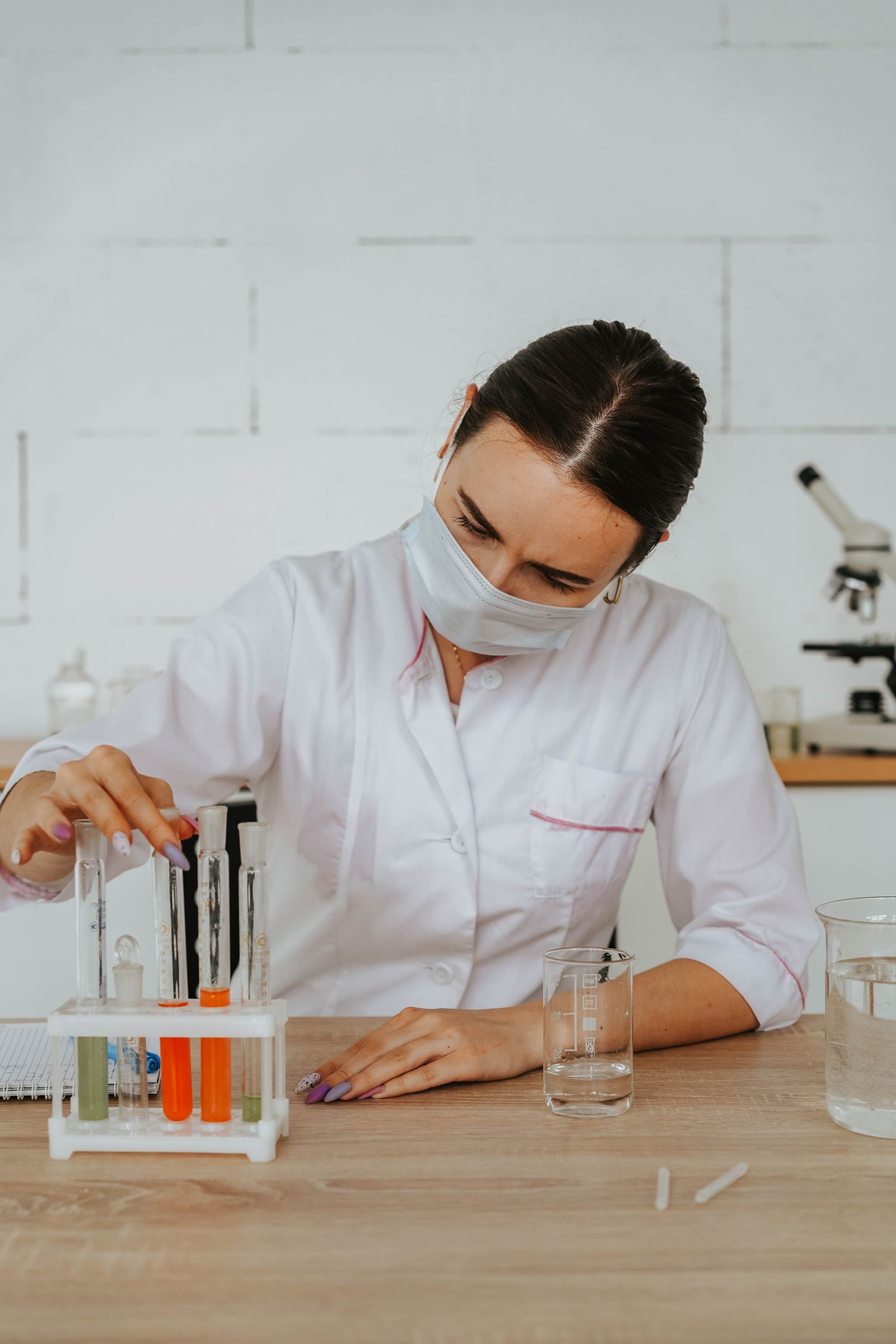 Female scientist conducting laboratory research, representing the evidence base for Ayurvedic treatment