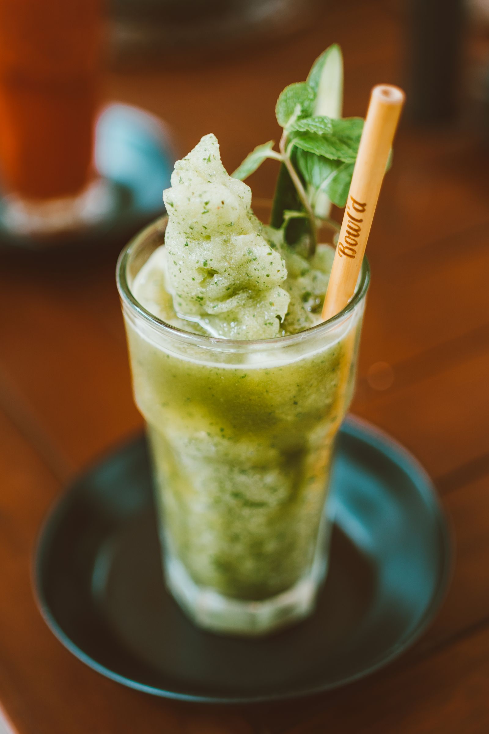Green detox smoothie with mint garnish, representing juice-cleanse style detox retreats