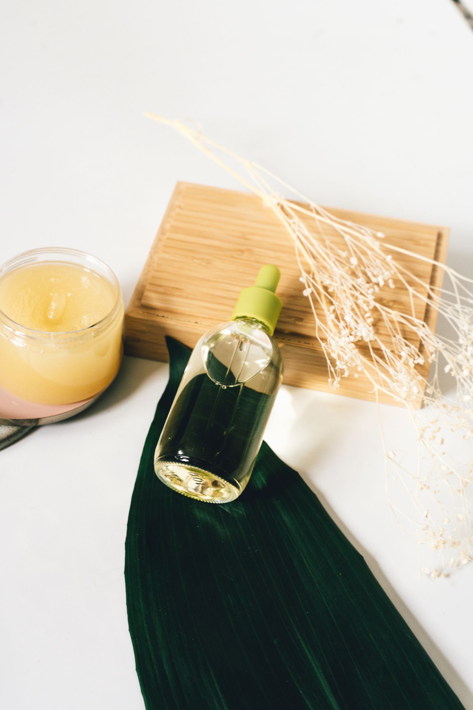 Natural skincare products with botanical ingredients, representing an Ayurvedic approach to skin conditions